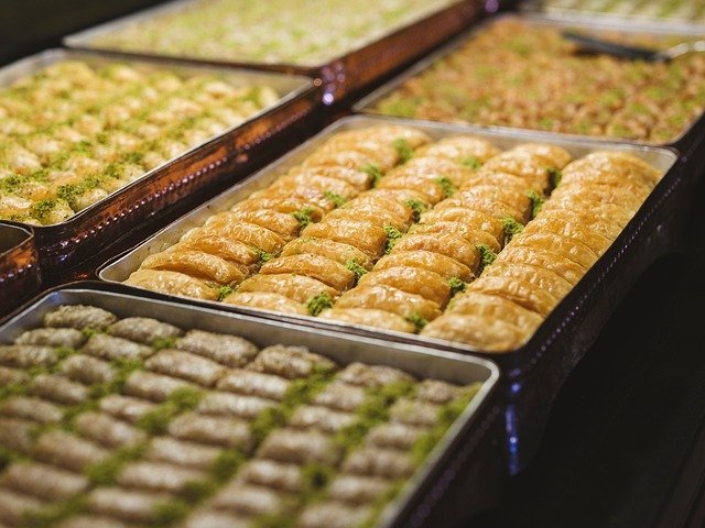 Traditional Turkish baklava dessert - layers of pastry with honey, pistachios and walnuts